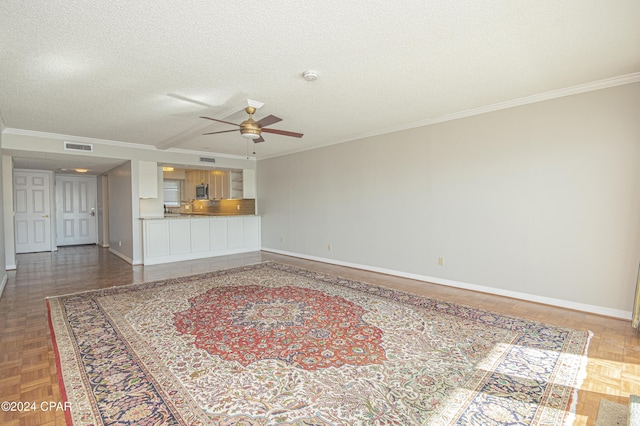 unfurnished living room featuring ornamental molding, a textured ceiling, ceiling fan, and parquet flooring