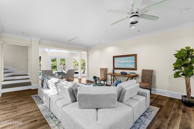 living room with ceiling fan, dark hardwood / wood-style flooring, and ornamental molding