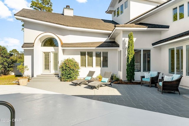 rear view of house with a patio