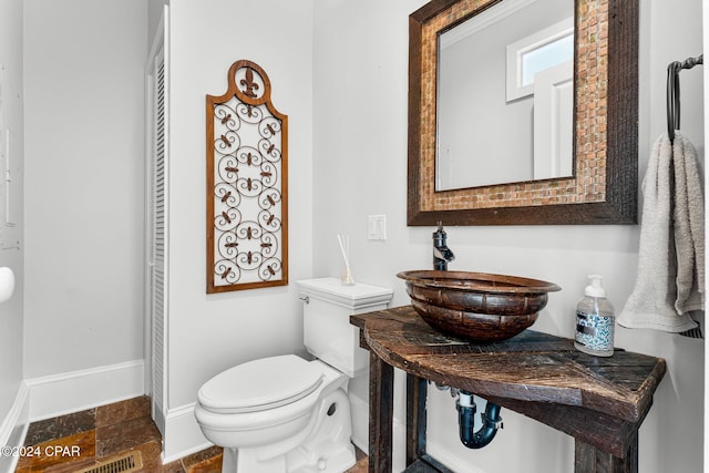 bathroom featuring sink and toilet