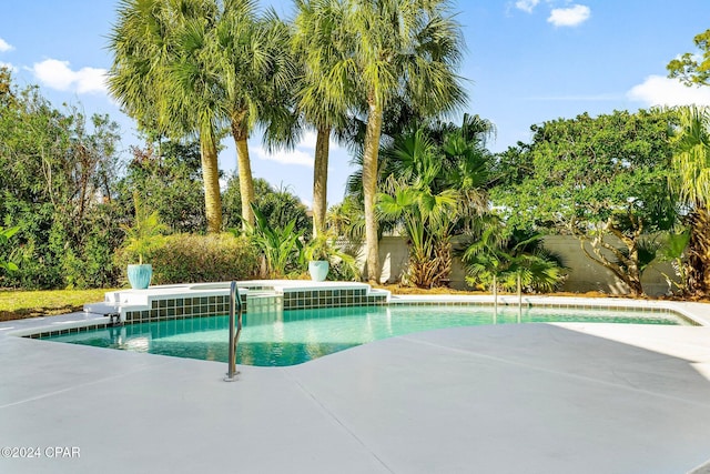 view of swimming pool featuring a patio