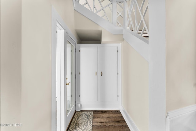 corridor with wood-type flooring