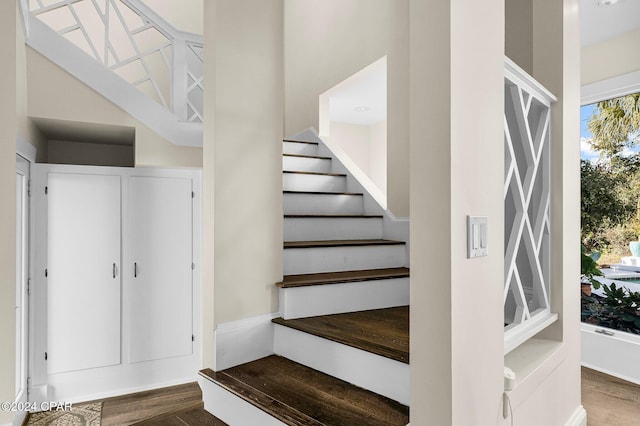 stairs featuring hardwood / wood-style floors