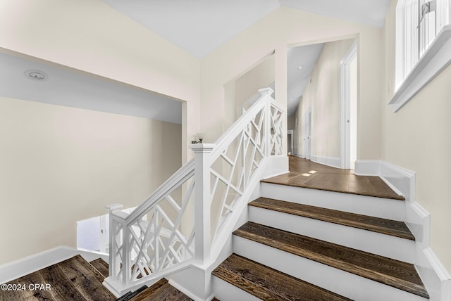 stairway with hardwood / wood-style flooring