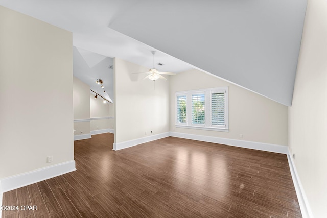 interior space featuring ceiling fan, dark hardwood / wood-style flooring, and lofted ceiling