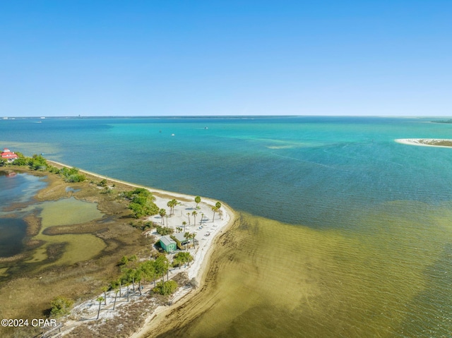 bird's eye view with a view of the beach and a water view