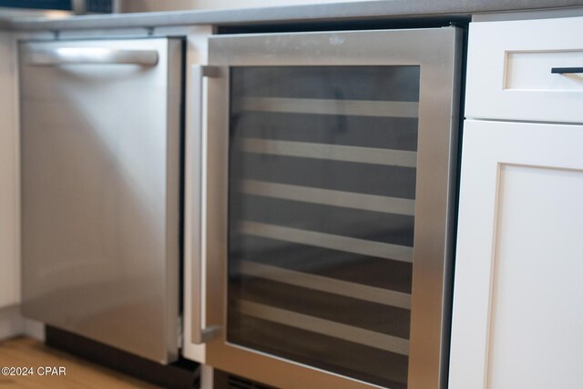 details featuring dishwasher and wine cooler