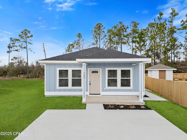 single story home featuring a patio and a front yard