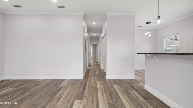 interior space featuring crown molding and dark hardwood / wood-style floors