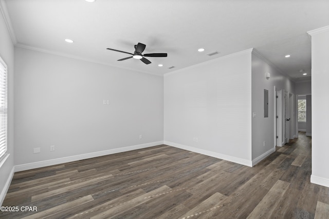 unfurnished room featuring ornamental molding, dark wood-type flooring, electric panel, and ceiling fan