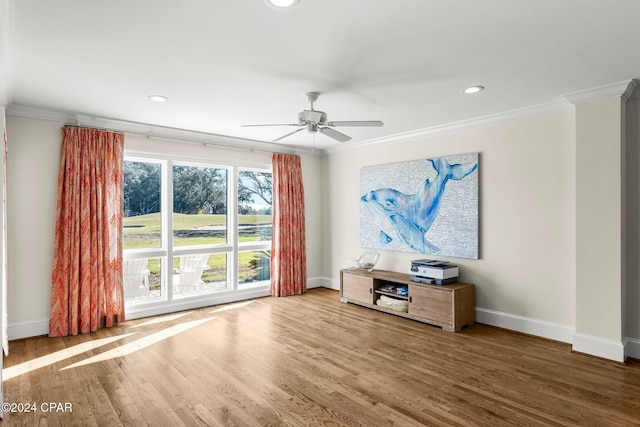 unfurnished living room with recessed lighting, crown molding, baseboards, and wood finished floors