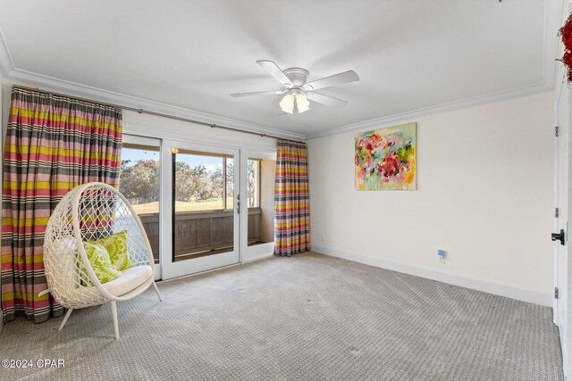 unfurnished room featuring carpet floors, ceiling fan, and crown molding