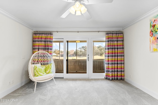 unfurnished room featuring baseboards, carpet, a ceiling fan, and crown molding