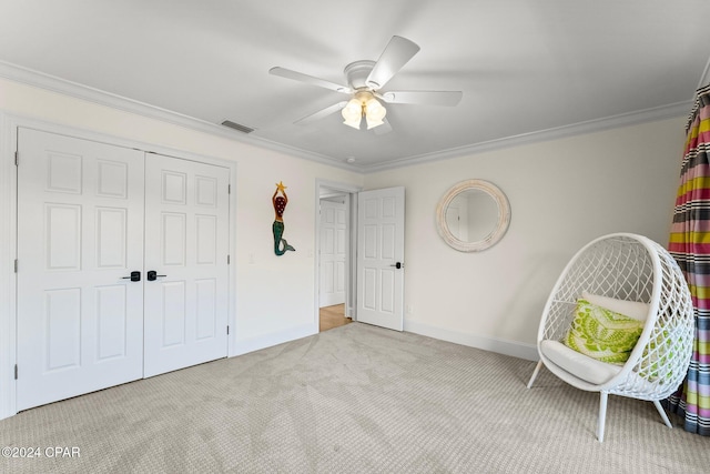 living area featuring ceiling fan, light colored carpet, and ornamental molding