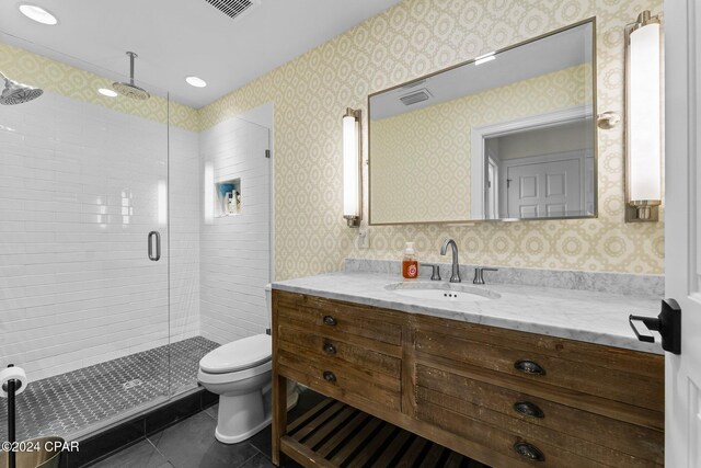 bathroom with walk in shower, tile patterned flooring, vanity, and toilet