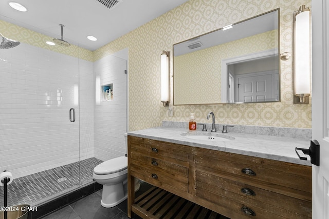 bathroom with toilet, wallpapered walls, tile patterned floors, and a stall shower