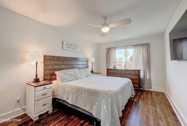 bedroom featuring dark hardwood / wood-style floors and ceiling fan