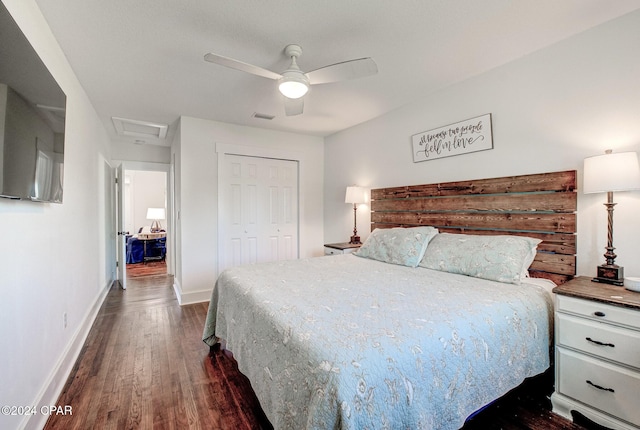 bedroom featuring ceiling fan, a closet, and dark wood-type flooring