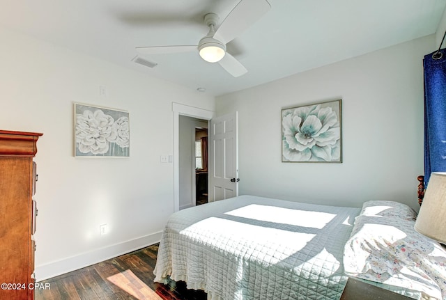 bedroom featuring dark hardwood / wood-style floors and ceiling fan