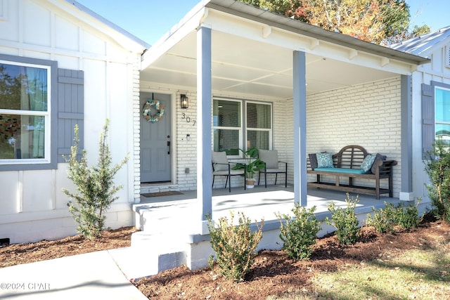 doorway to property featuring a porch