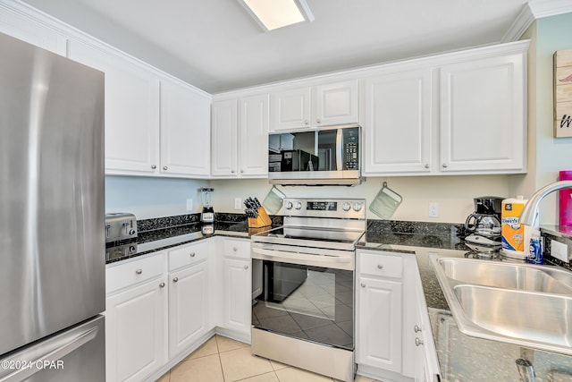 15817 Front Beach Rd Unit 1-1505, Panama City Beach, FL 32413 - kitchen featuring white cabinets, a sink, dark stone countertops, stainless steel appliances, and light tile patterned floors