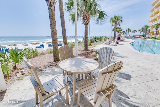 15817 Front Beach Rd Unit 1-1505, Panama City Beach, FL 32413 - view of patio with a view of the beach, a community pool, and a water view