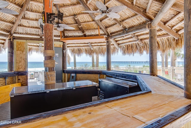 15817 Front Beach Rd Unit 1-1505, Panama City Beach, FL 32413 - kitchen featuring a water view, a ceiling fan, and beam ceiling