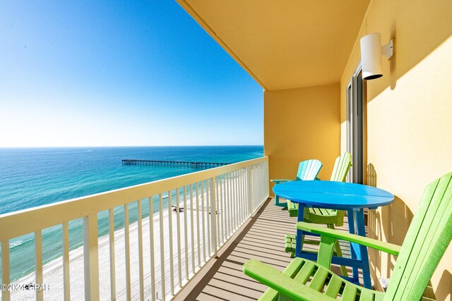 balcony with a view of the beach and a water view