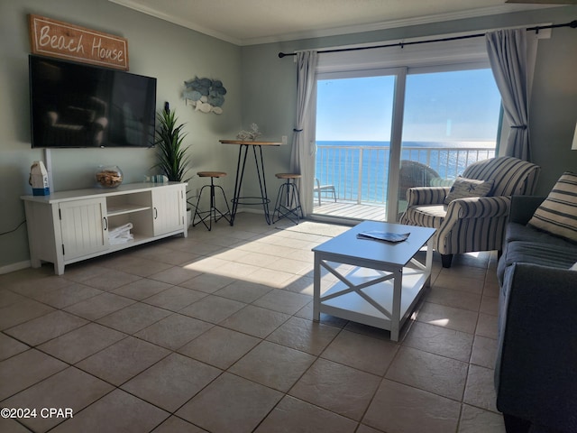 tiled living room featuring a water view and crown molding