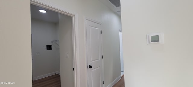 corridor with dark hardwood / wood-style floors