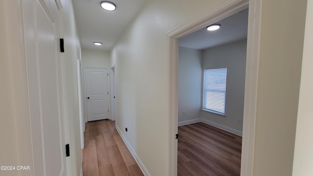 hall with light hardwood / wood-style flooring