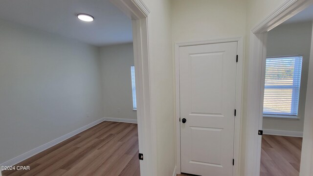 hallway featuring light wood-type flooring