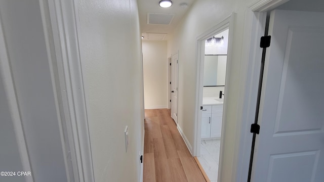 hall with light hardwood / wood-style flooring