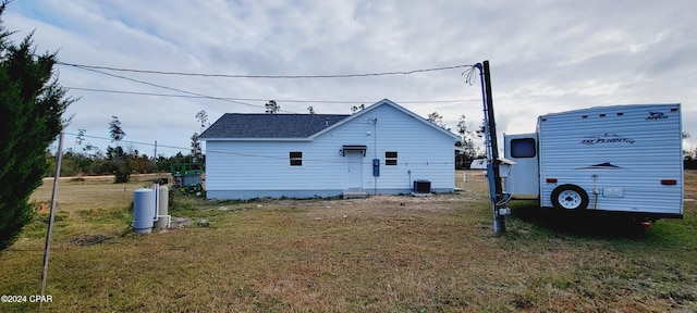 view of property exterior with a yard