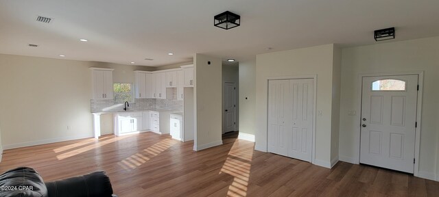 interior space featuring sink and hardwood / wood-style floors