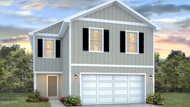 view of front property with a garage and a front yard