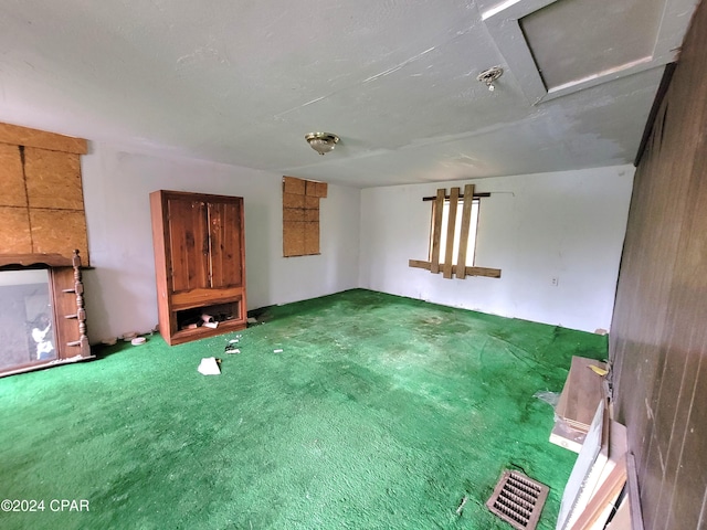 unfurnished living room featuring carpet floors