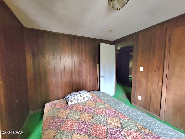 bedroom with wooden walls