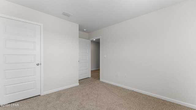 unfurnished bedroom featuring carpet