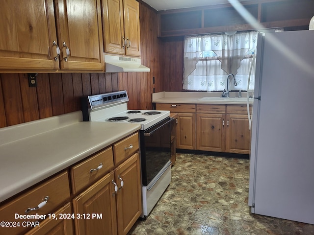 kitchen with sink and white appliances