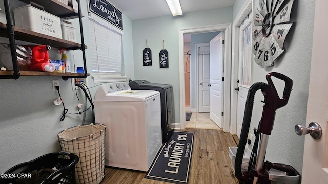 laundry area featuring dark hardwood / wood-style floors and washer and dryer