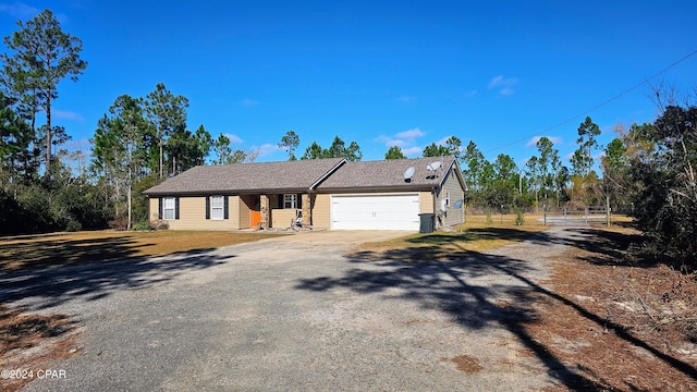 ranch-style home featuring a garage