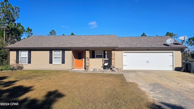 single story home featuring a garage and a front yard