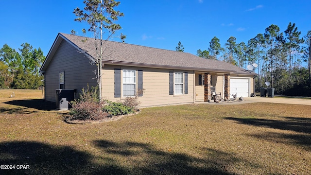 view of front of house with a garage and a front yard