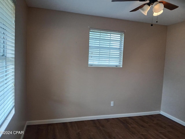 spare room featuring ceiling fan and dark hardwood / wood-style flooring