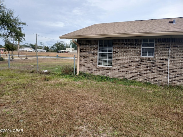 view of home's exterior with a lawn