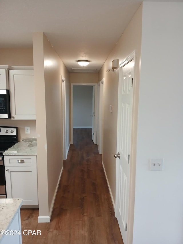 hall featuring dark wood-type flooring