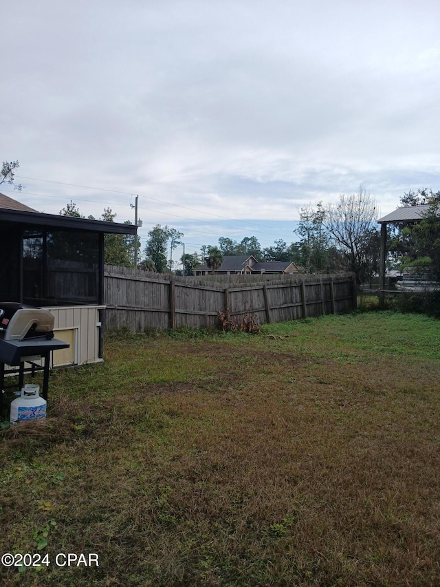 view of yard with a sunroom