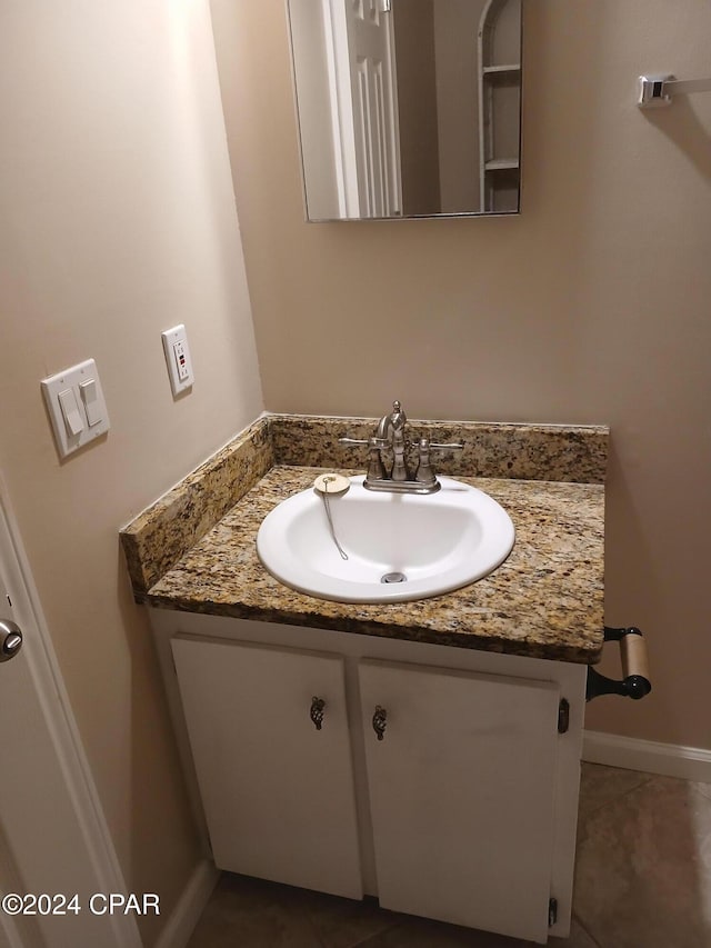 bathroom with tile patterned flooring and vanity