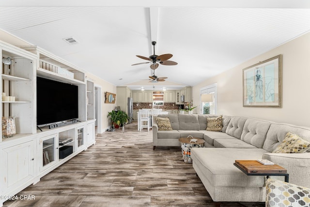 313 Argonaut St, Panama City Beach, FL 32413 - living area with lofted ceiling, wood finished floors, visible vents, and a ceiling fan